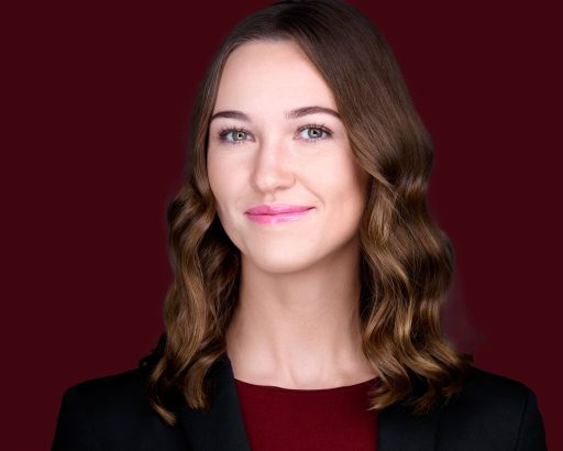 Professional Headshot with maroon background